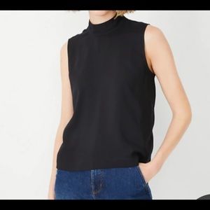 Ann Taylor mock sleeveless button back blouse.